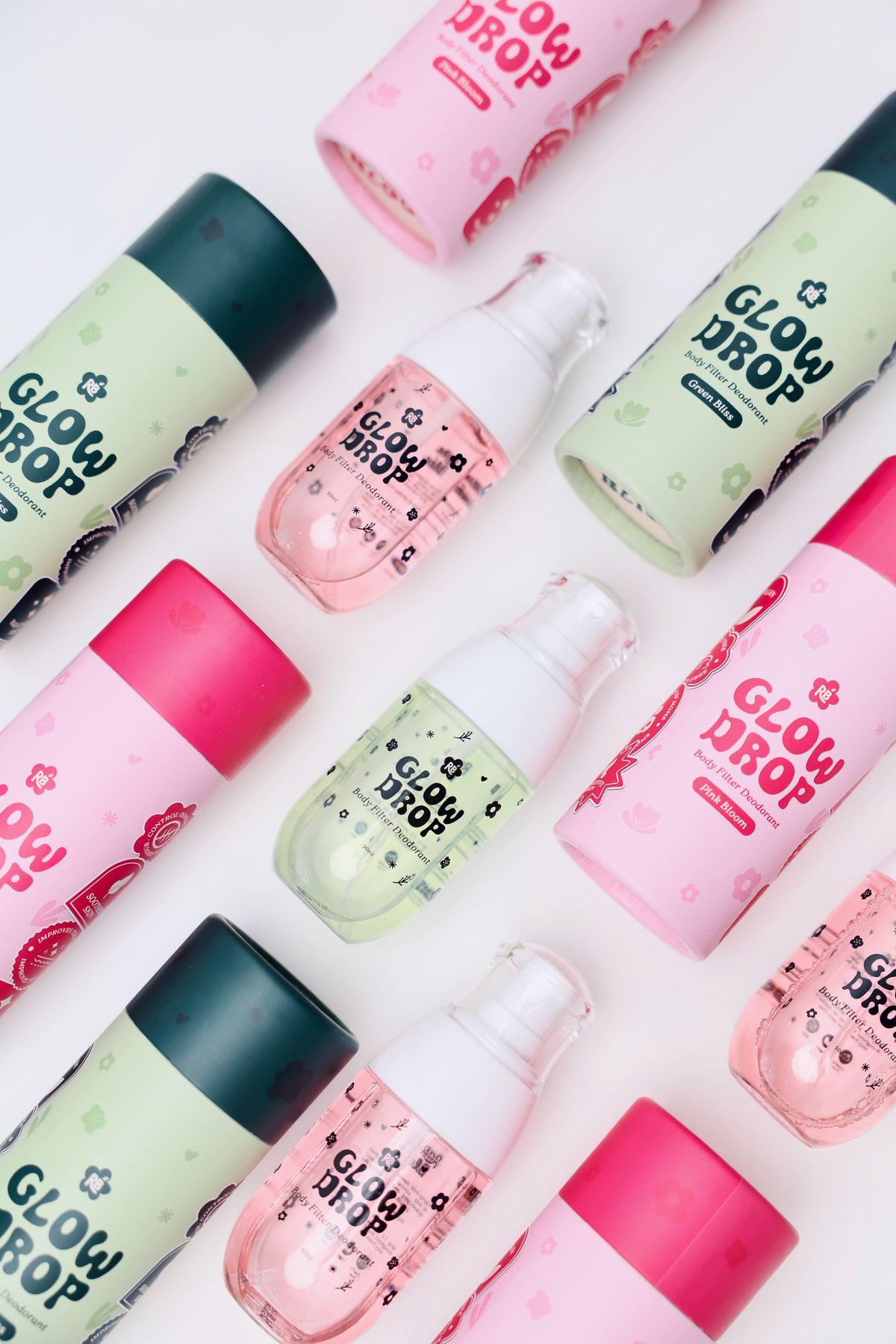 Glow Drop full collection editorial flatlay with tubes and foam bottles